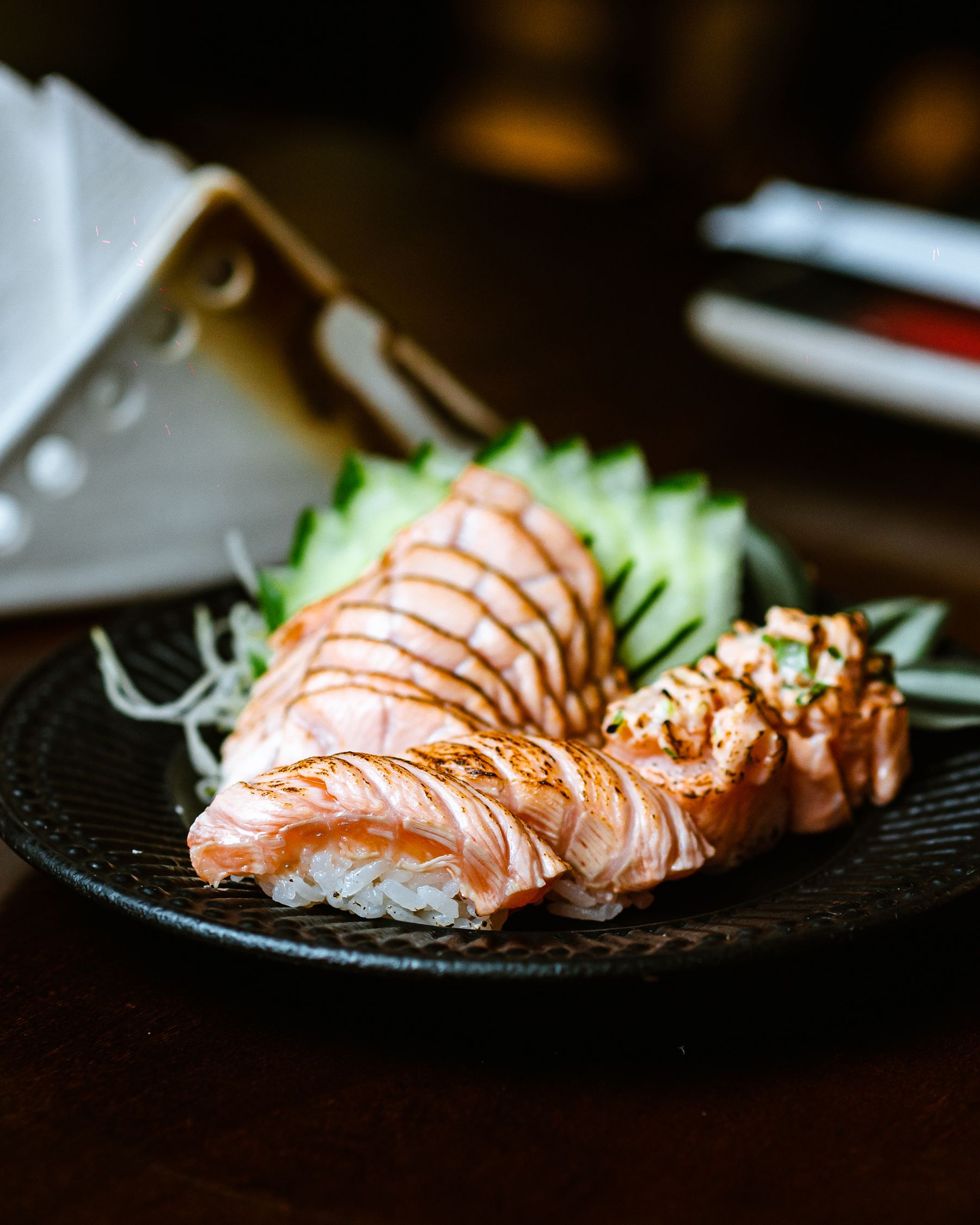 Seared salmon sashimi with garnish